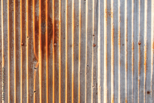 Wall aluminum silver stainless. Old  rusted zinc surface texture Gray galvanized iron wall texture  Zinc with rust pattern background Close up to pattern texture vertical zinc sheet Zinc vintage view.