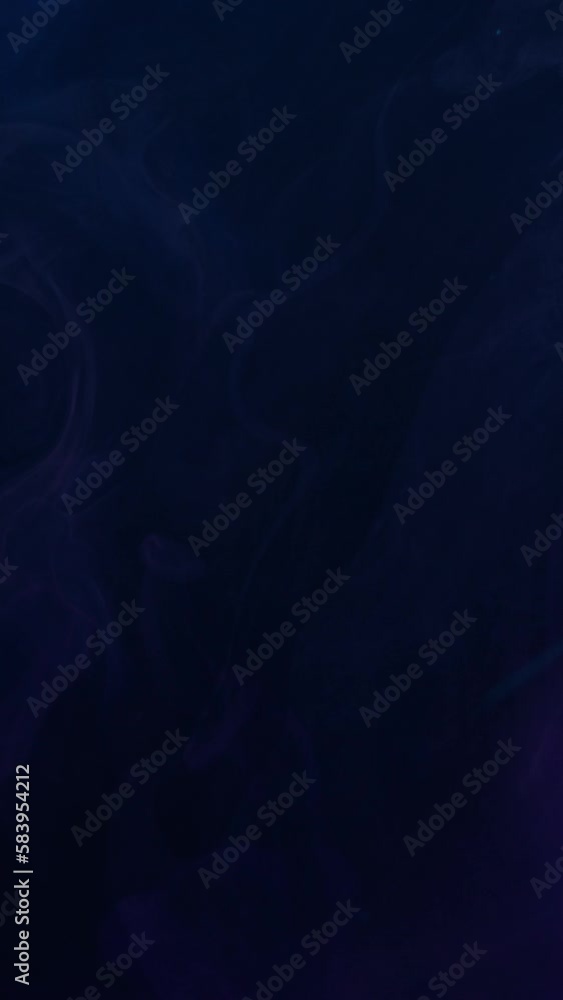 Vertical video. Color flash. Fume texture. Fire alarm. Neon blue purple pink green striking light smoke on dark black abstract background shot on RED. Vertical video. Color flash. Fume texture. Fire alarm. Neon blue purple pink green striking light smoke on dark black abstract background shot on RED.