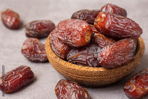 pile of delicious dates on a wooden bowl, iftar meal
