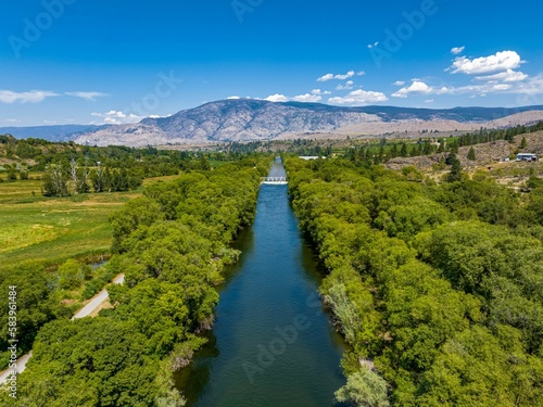 Принти на полотні View  of channel near vineyards in Oliver, British Columbia, Canada with valley