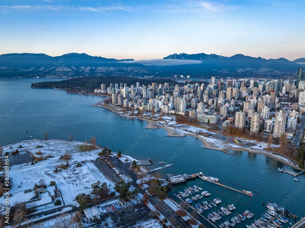Naklejka premium Aerial shot of the beautiful Vancouver city in Canada with many skyscrapers during the winter