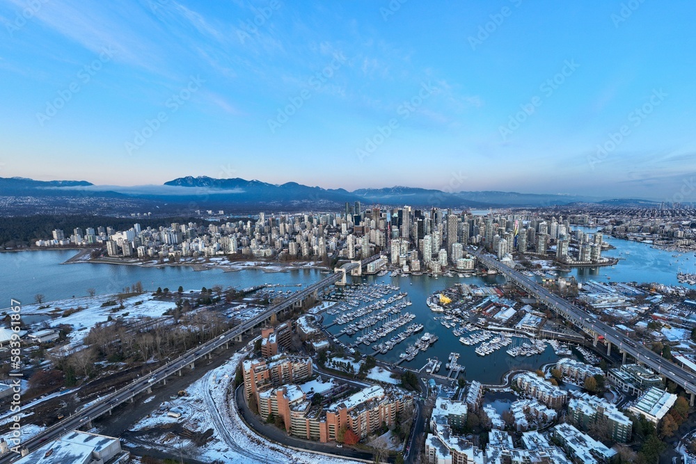 Fototapeta premium Aerial shot of the beautiful Vancouver city in Canada with many skyscrapers during the winter