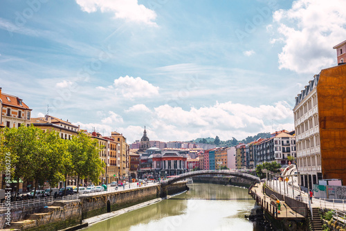 Bilbao city with colorful architecture and the Nervion river on a sunny day. Enjoying a nice vacation in the Basque Country, Spain