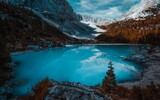 Beautiful view of a blue lake surrounded by forest and mountains