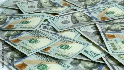 Money is falling from above. Recalculation of money. Money in 100 dollar bills . 