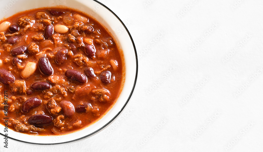 Baked beans with ground beef, jalapeno pepper and bacon Photos Adobe
