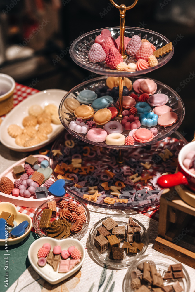 Candy cookies and sweets on a three-tier stand Candy cookies and sweets on a three-tier stand