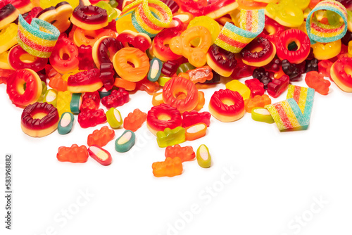 Assorted colorful gummy candies. Top view. Jelly donuts. Jelly bears. Isolated on a white background.