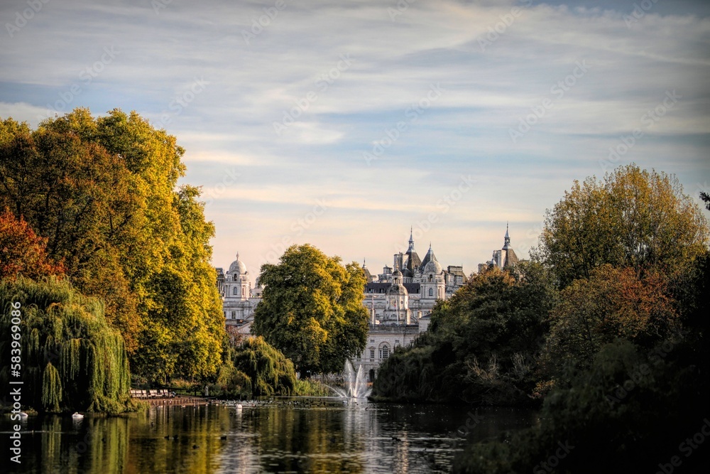 Splendid architecture of Westminster, central London captured from St James's park with leafy trees