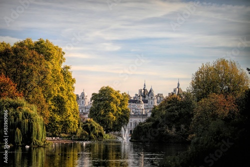 Splendid architecture of Westminster, central London captured from St James's park with leafy trees