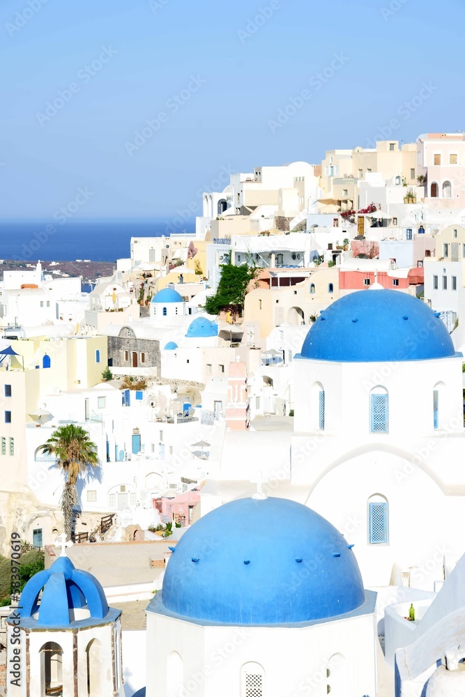 Vertical shot of the beautiful white Santorini in Greece