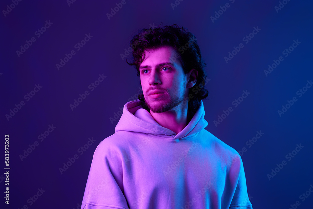 handsome bearded man in sweatshirt on blue background. handsome bearded man in sweatshirt on blue background.