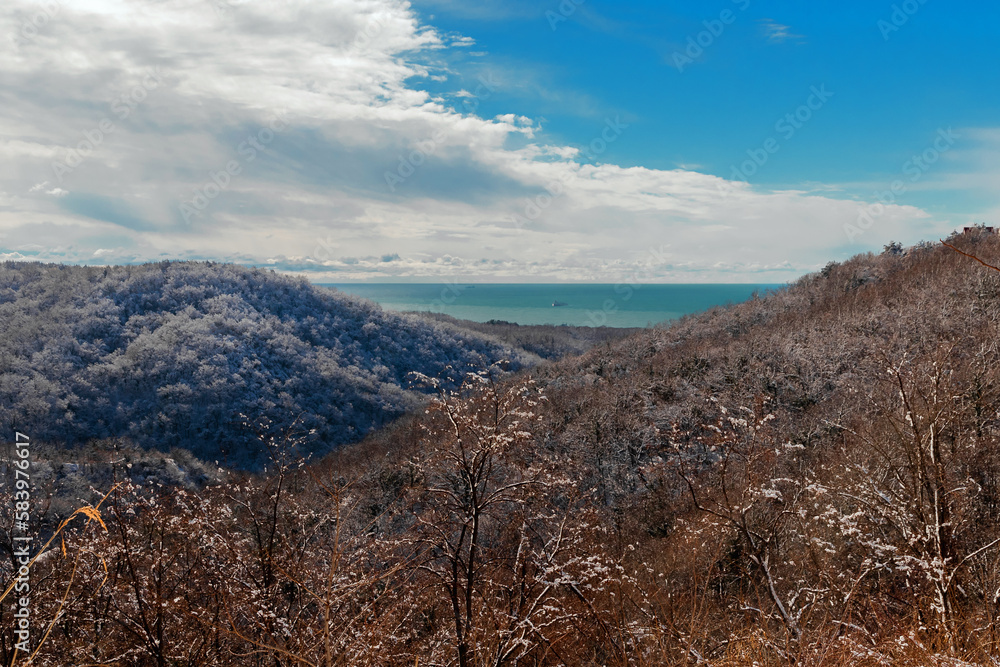 Mountain landscape under a blue sky. Snow-capped mountains under a blue sky on a sunny day. Snow-covered mountain landscape under a blue sky in winter. Mountain landscape under a blue sky. Snow-capped mountains under a blue sky on a sunny day. Snow-covered mountain landscape under a blue sky in winter.