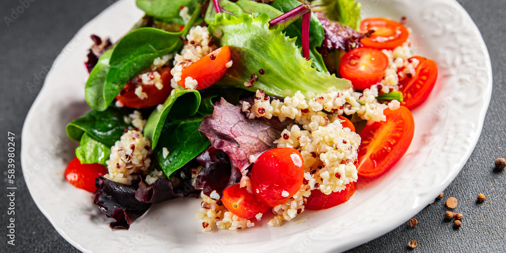 quinoa salad tomato, green leaf mix healthy meal food snack on the table copy space food background rustic top view 