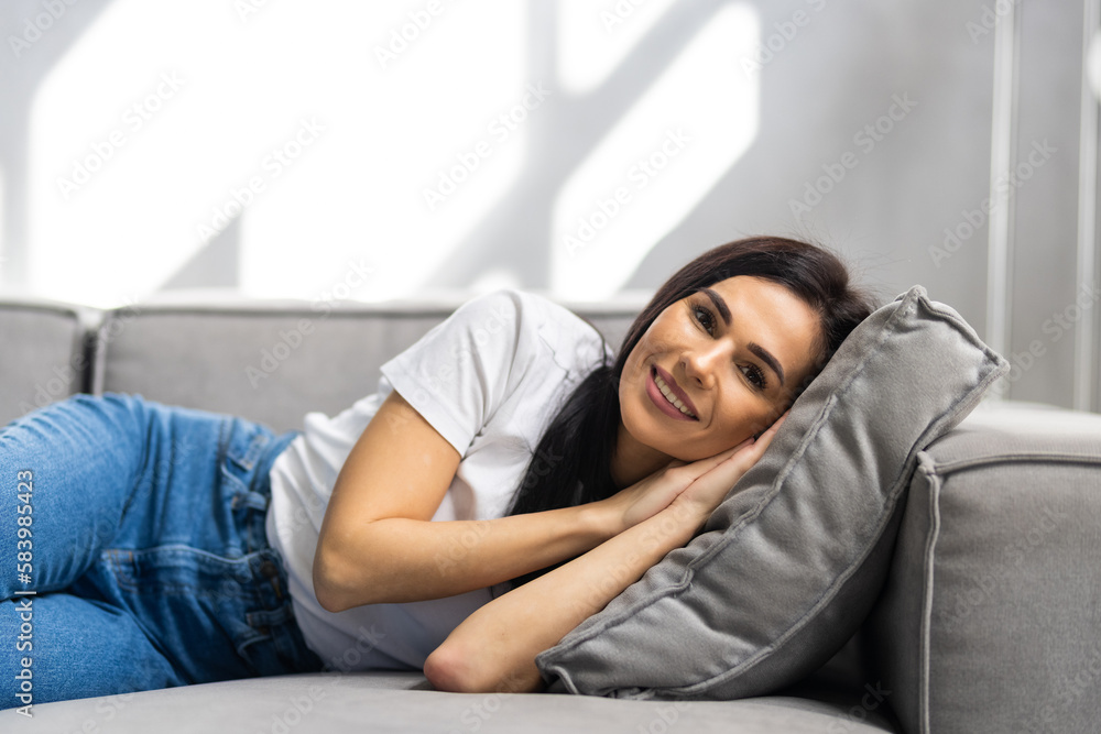 Peaceful girl relax on comfortable sofa with eyes closed sleeping resting at home, female feel fatigue fall asleep Peaceful girl relax on comfortable sofa with eyes closed sleeping resting at home, female feel fatigue fall asleep