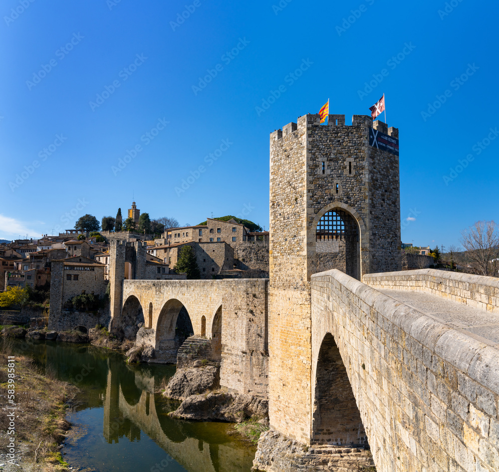 view of the medieval Romanesque bridge and village of Besalu in Catalonia