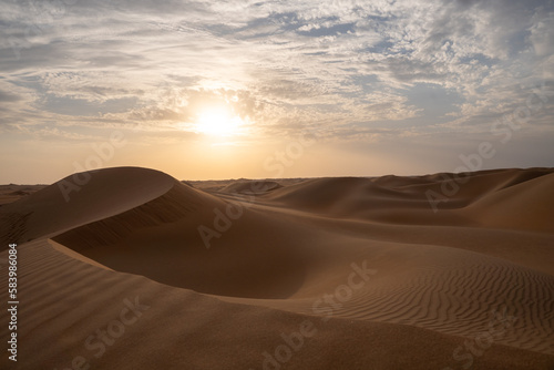 Sunset on the dunes in the empty quarter  desert   near Abu Dhabi in the United Arab Emirates.