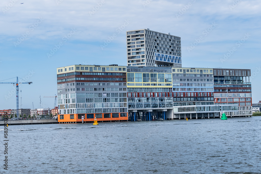 Panoramic view from the IJ river to Western harbor area (Amsterdam-Noord borough), along the IJ river. AMSTERDAM, The NETHERLANDS.