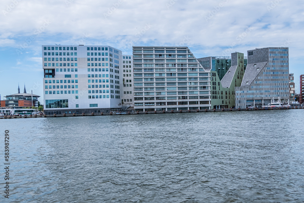 Panoramic view from the IJ river to Western harbor area (Amsterdam-Noord borough), along the IJ river. AMSTERDAM, The NETHERLANDS.