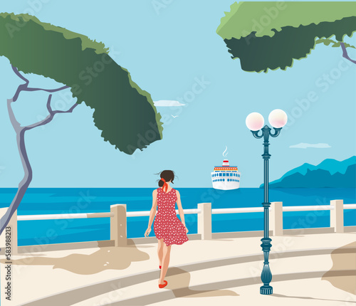 Femme se promenant en bord de mer avec un paquebot au loin