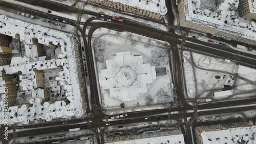 Aerial video of Stockholm, Sweden, Gustaf Vasa Odenplan church, covered in snow photo