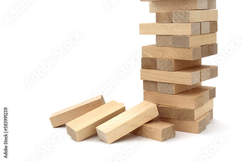 A game of wooden bricks in a half-destroyed state be on a white background. 