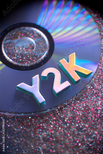Y2K Letters on Music CD with Glittery Background photo