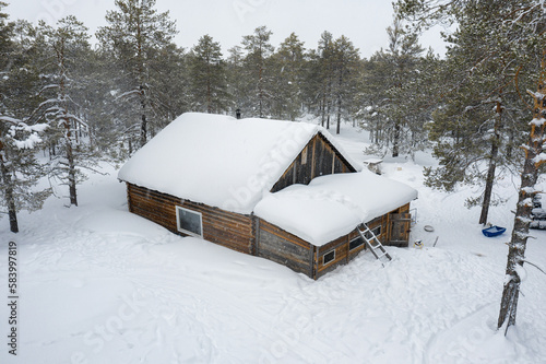Western Siberia, the camp of reindeer herders of the Khanty people: the hut in the forest. Aerial view.
