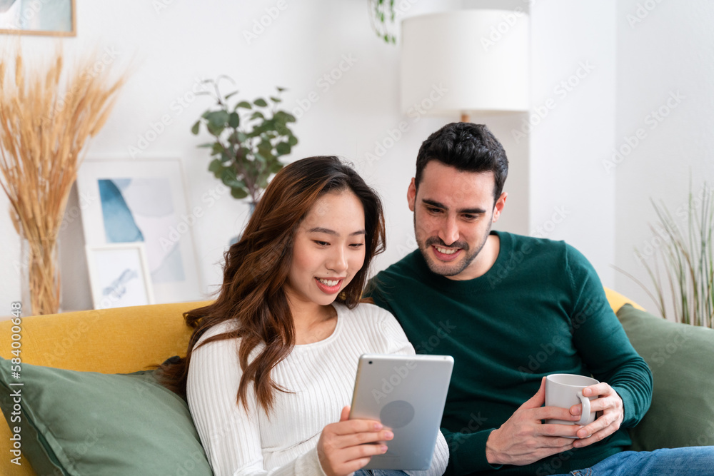 Happy couple using tablet together Happy couple using tablet together