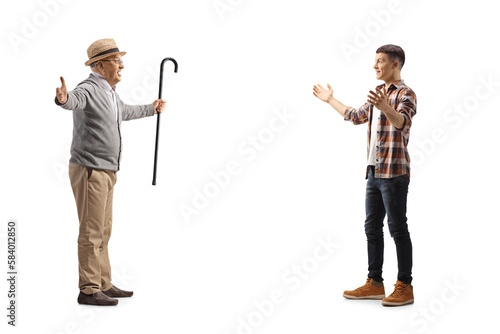 Excited grandfather with arms wide open waiting to hug teenage grandson