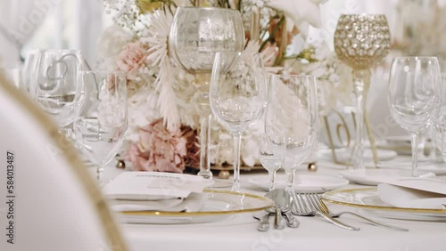 Wedding table set with tablecloth luxury crockery and flowers