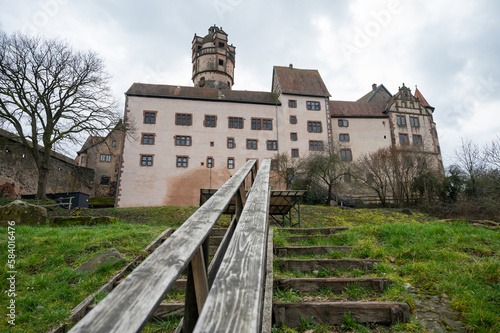 Ronneburg Castle with wooden stairs and railing in front during cloudy day, Germany