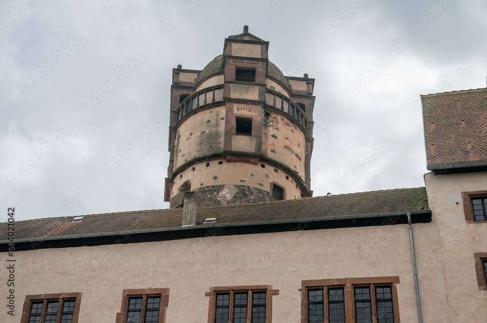 Main Tower of Ronneburg Castle with building in front, view from low angle during cloudy day, Germany