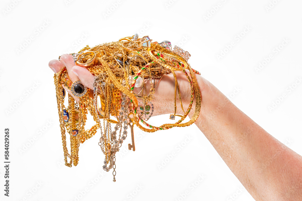 Woman’s Hand Holding Jewelry Isolated On White With Copy Space Woman’s Hand Holding Jewelry Isolated On White With Copy Space