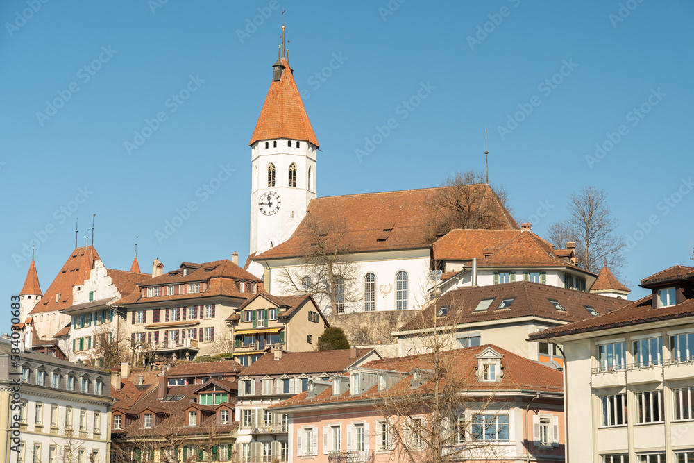 City of Thun with the tower of a church in the background in Switzerland