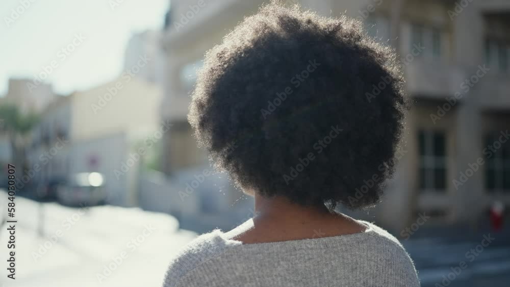 African american woman looking to the side with serious expression at street African american woman looking to the side with serious expression at street