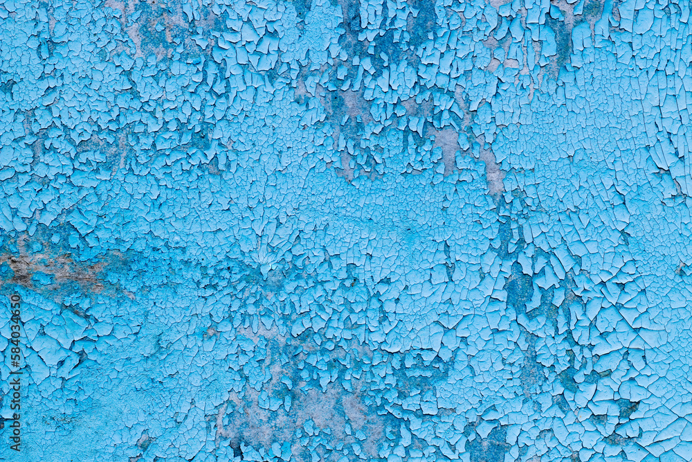 Blue texture of old cracked paint, grunge background.