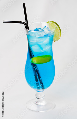 blue cocktail with lime isolated on white background