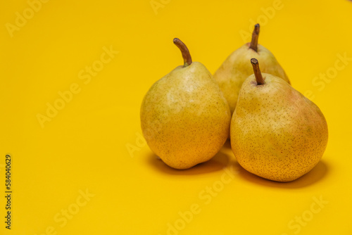 Organic Pear on a yellow. Juicy fruit, cool minimal copy space. (ID: 584040629)