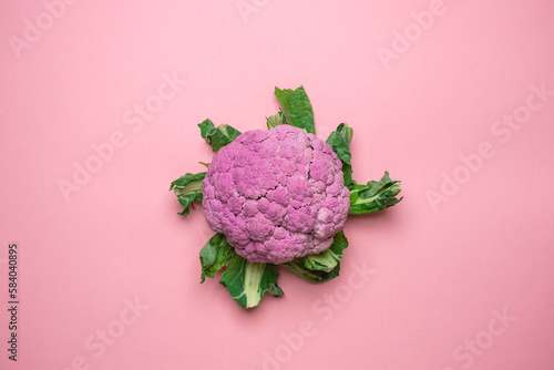 Pink cauliflower on a pink background. Cool minimal flat lay, copy space.