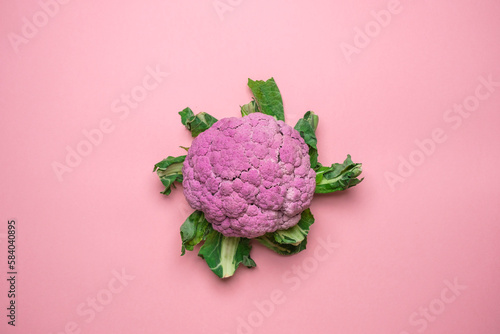 Pink cauliflower on a pink background. Cool minimal flat lay, copy space. (ID: 584040895)