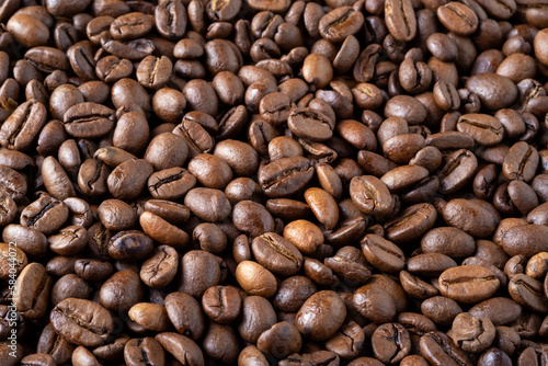 Roasted coffee beans background. Selective focus.