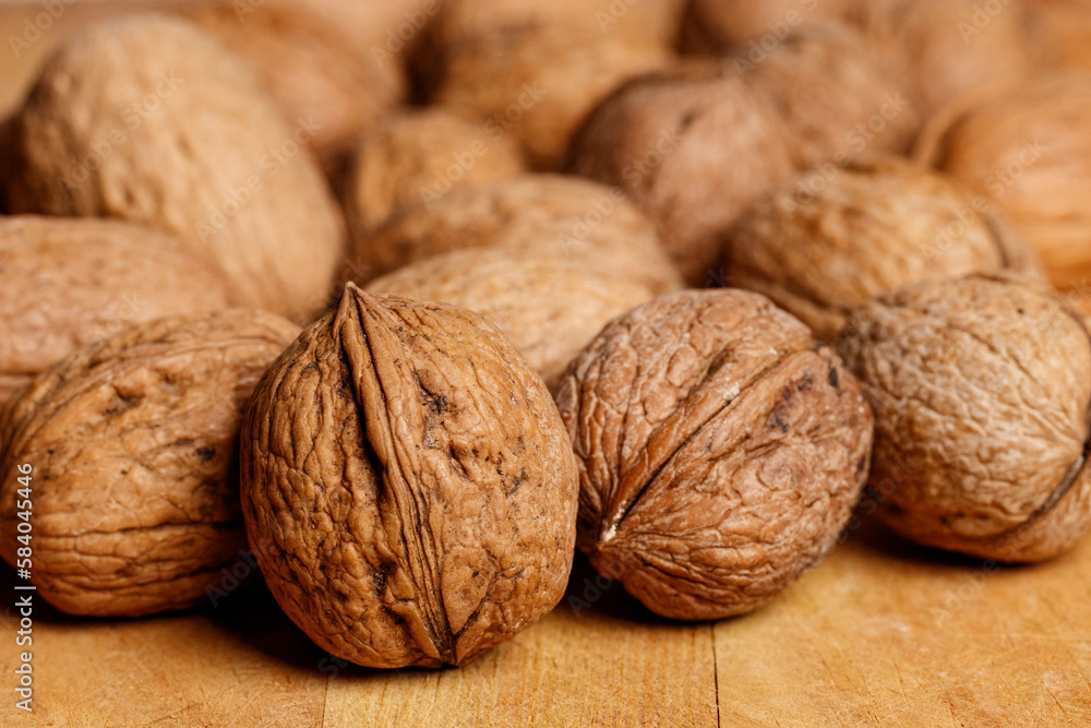 A group of tasty organic Sorrento walnuts on a wooden table A group of tasty organic Sorrento walnuts on a wooden table
