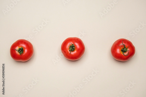 Red Tomatoes fresh organically grown on white background. Cool minimal flat lay, copy space