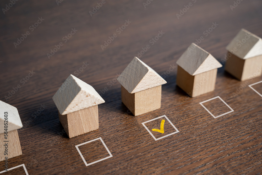 House selection. The selected house is checked with a tick. Checkbox. Difficulty of finding the perfect home. Searching for a new home. Mark the preferred choice. Real estate market offers overview. - obrazy, fototapety, plakaty 