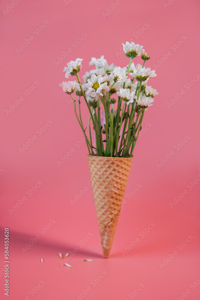Waffle cone with bouquet of beautiful white Chrysanthemums 