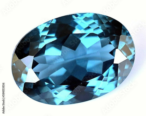 Natural gemstone blue spinel on a gray background photo