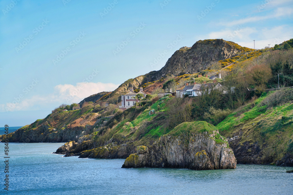 Howth Head cliff in Howth, Ireland, with houses overlooking the ocean