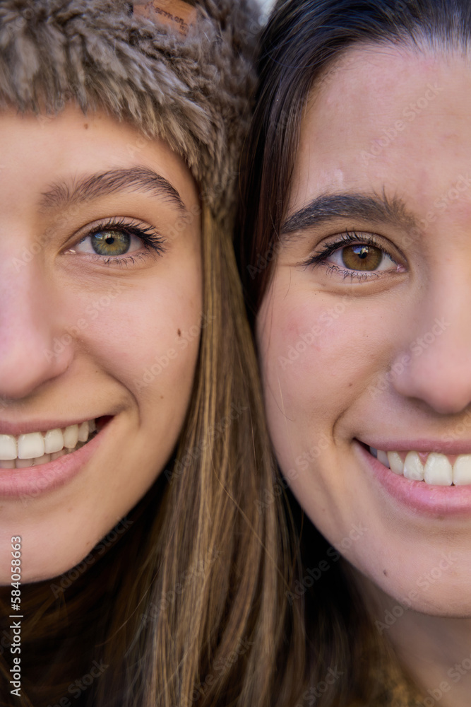 half face of two woman close up. two halves of the face of the girlfriends half face of two woman close up. two halves of the face of the girlfriends