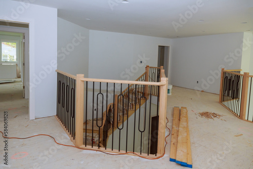 Photography Large amount of progress is being made on assembly and installation of wooden railings in new house